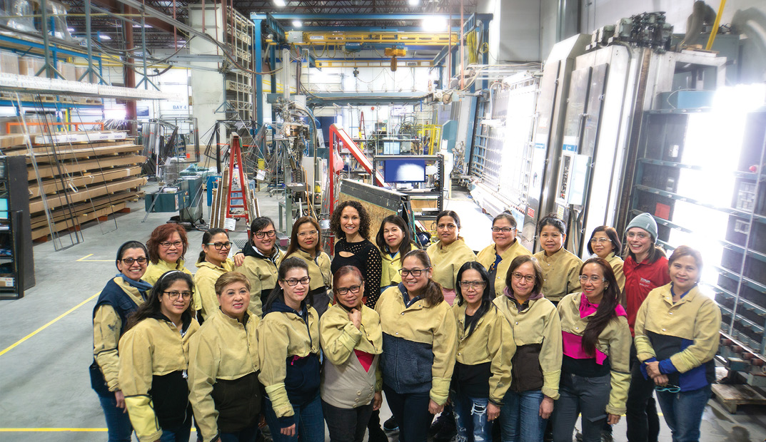  Gemma Martini, CEO of Vitrum Glass Group, with the all-women Insulating Glass Unit assembly team. 