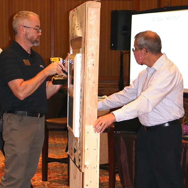 Rich Rinka, technical manager, fenestration standards and U.S. industry affairs, and Jason Seals, certification services manager, fenestration, led in-person Fenestration and Glazing Industry Alliance Hybrid Fall Conference participants through the steps of two different window installation techniques that are included in the InstallationMasters training program: ASTM E2112 Method A1 and FMA/AAMA 100 Method C.